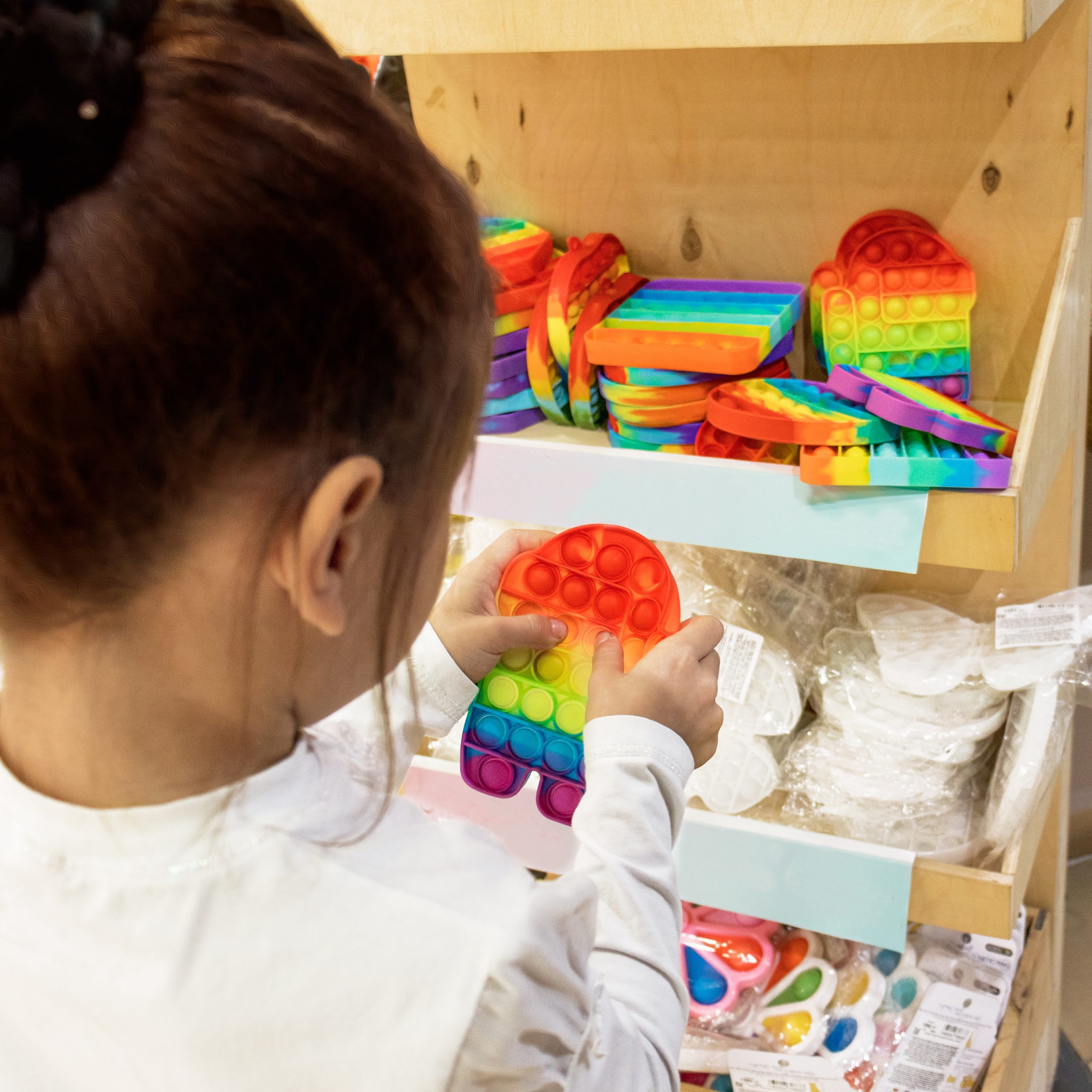 asian child girl playing with a toy bursting it i 2025 01 10 05 31 44 utc scaled